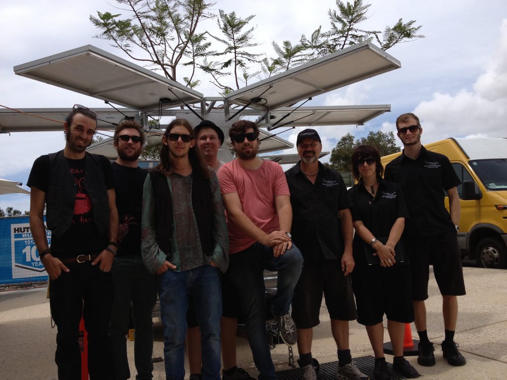 Contemporary band Clock's and Dice, Technical Officer Troy Schmidt and (SCU) production students Anastasia Scales and Tom Moyaham with solar power generator. Contemporary band Clock's and Dice, Technical Officer Troy Schmidt and (SCU) production students Anastasia Scales and Tom Moyaham with solar power generator.