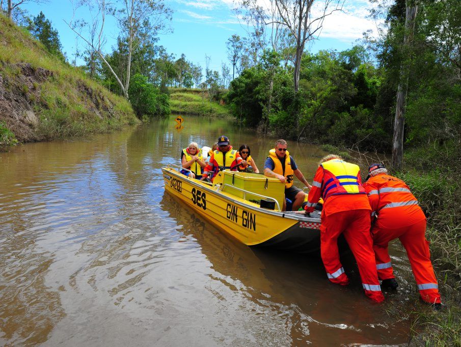 Gin Gin SES volunteers busy ferrying Goodnight Scrub locals across Perry River after flood waters blocked the road. Gin Gin SES volunteers busy ferrying Goodnight Scrub locals across Perry River after flood waters blocked the road.