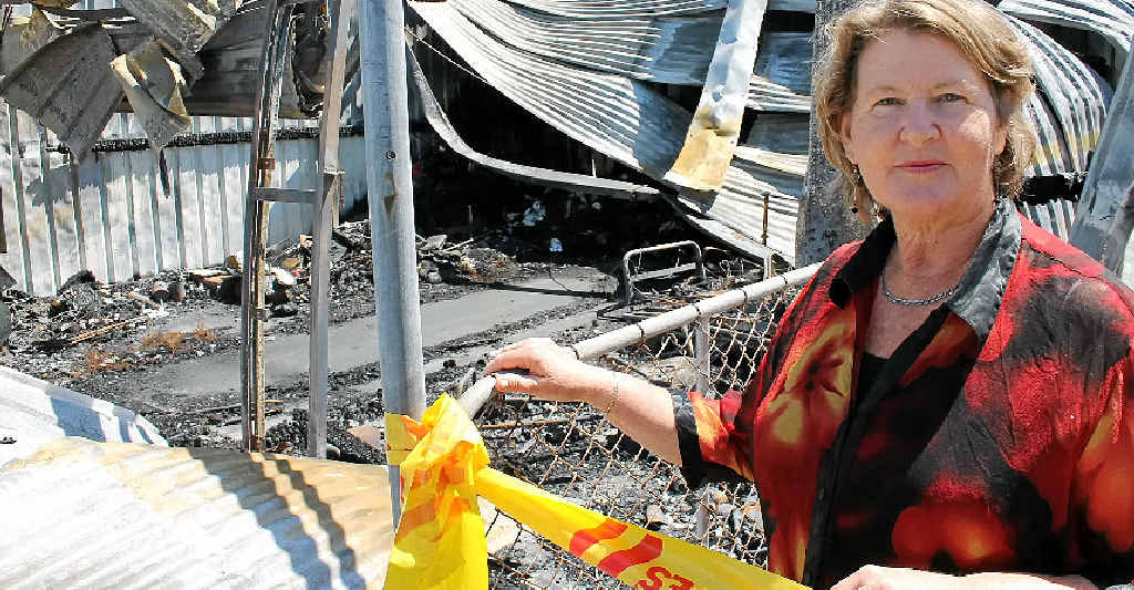 DESTROYED: Carmel Campbell with her burnt out garage. DESTROYED: Carmel Campbell with her burnt out garage.
