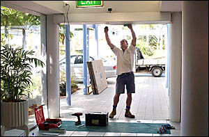 Ashley Grove starts on the repairs to the glass doors that were smashed in a ram-raid Ashley Grove starts on the repairs to the glass doors that were smashed in a ram-raid
