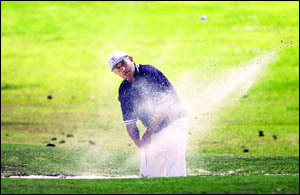 UP AND DOWN: Ray Darragh, of Beaudesert, blasts out of a sandtrap during the Lismore Pro-Am yesterday UP AND DOWN: Ray Darragh, of Beaudesert, blasts out of a sandtrap during the Lismore Pro-Am yesterday
