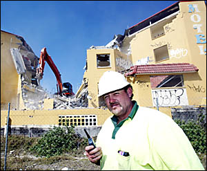DEMOLITION man Paul Hennegan oversees the demolition of Kingscliff?s Pacific Sands Motel yesterday DEMOLITION man Paul Hennegan oversees the demolition of Kingscliff?s Pacific Sands Motel yesterday