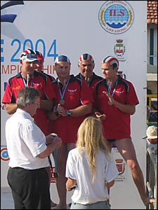 The masters team is pictured receiving their bronze medal. The masters team is pictured receiving their bronze medal.