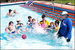 SUMMER SWIM: Prue Walker, of Lennox Head, teaches a group of local parents and their children. SUMMER SWIM: Prue Walker, of Lennox Head, teaches a group of local parents and their children.