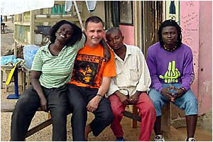 GETTING BY WITH A LITTLE HELP ...: ABC radio presenter Martin Corben with new friends in Busua. GETTING BY WITH A LITTLE HELP ...: ABC radio presenter Martin Corben with new friends in Busua.