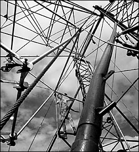 MOVING ON: As part of the clean-up Kerry O?Shea, of Grafton, works on unhooking the connec- tions of the ferris wheel. MOVING ON: As part of the clean-up Kerry O?Shea, of Grafton, works on unhooking the connec- tions of the ferris wheel.