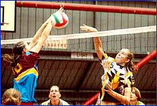 Capricornia?s Rhiannon Tooker spikes the ball past the desperate South Coast blockers Capricornia?s Rhiannon Tooker spikes the ball past the desperate South Coast blockers