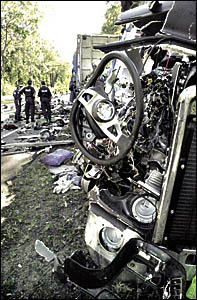 A scene from the fatal accident early yesterday morning, 15 kilometres south of Woodburn, involving two semi-trailers. One driv A scene from the fatal accident early yesterday morning, 15 kilometres south of Woodburn, involving two semi-trailers. One driv