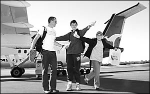 Coffs Harbour teenagers Peter Ball and Blake Moore, with carer Rowan Kimberg, get ready to leave on a trip of a lifetime to Syd Coffs Harbour teenagers Peter Ball and Blake Moore, with carer Rowan Kimberg, get ready to leave on a trip of a lifetime to Syd