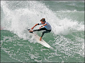 CHRIS Bennetts of Main Beach tackles the hefty seas at Duranbah yesterday to take out the Bill CHRIS Bennetts of Main Beach tackles the hefty seas at Duranbah yesterday to take out the Bill