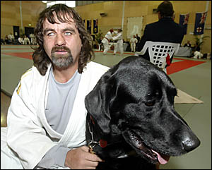 BLIND judo champ Anthony Clarke keeps close tabs on his dog Hawke who he relies on when he travels country competing and speaki BLIND judo champ Anthony Clarke keeps close tabs on his dog Hawke who he relies on when he travels country competing and speaki