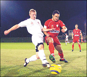 Newcastle United?s Steve Eagleton, left, and Adelaide United?s Travis Dodd battle for possession during the Hyundai A-League fr Newcastle United?s Steve Eagleton, left, and Adelaide United?s Travis Dodd battle for possession during the Hyundai A-League fr