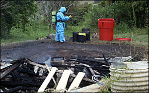 FIREFIGHTERS donned breathing apparatus and spillage suits to tackle a suspicious fire in a shed containing unknown substances FIREFIGHTERS donned breathing apparatus and spillage suits to tackle a suspicious fire in a shed containing unknown substances