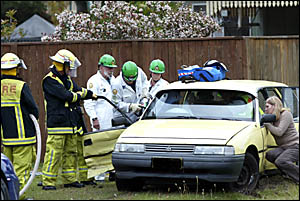 TWEED District Rescue Squad members work to free a woman trapped in her vehicle after she was involved in an accident at a noto TWEED District Rescue Squad members work to free a woman trapped in her vehicle after she was involved in an accident at a noto