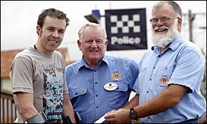 MURWILLUMBAH police officer Bill Chaffey (left), injured in a cycling accident, gets a helping hand from Kingscliff Lions Club MURWILLUMBAH police officer Bill Chaffey (left), injured in a cycling accident, gets a helping hand from Kingscliff Lions Club