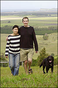 IN LIMBO: Tony and Rie Gilding with Shiro the dog on the Newrybar property they purchased last year. Picture: COLLEEN BACON IN LIMBO: Tony and Rie Gilding with Shiro the dog on the Newrybar property they purchased last year. Picture: COLLEEN BACON