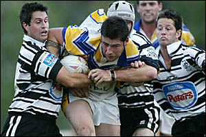 oMURWILLUMBAH?S Lyndon Murphy bullocks through traffic with Seagulls backs Jeremy Walters, left, and Daniel Evans involved in t oMURWILLUMBAH?S Lyndon Murphy bullocks through traffic with Seagulls backs Jeremy Walters, left, and Daniel Evans involved in t