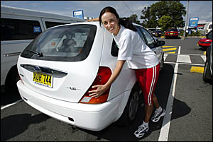 Saskia Parsons of Cudgen shows her fuel-efficient Ford Laser some love, because with rising fuel prices, it pays to have a smal Saskia Parsons of Cudgen shows her fuel-efficient Ford Laser some love, because with rising fuel prices, it pays to have a smal