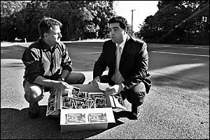 NSW Minister for Roads Joe Tripodi (right) said the Highway Hell postcards presented to him yesterday by Coffs Coast Advocate c NSW Minister for Roads Joe Tripodi (right) said the Highway Hell postcards presented to him yesterday by Coffs Coast Advocate c