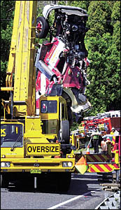 FATAL ACCIDENT: A crane lifts the wreckage of a truck that crashed early yesterday morning near Tintenbar, killing its driver. FATAL ACCIDENT: A crane lifts the wreckage of a truck that crashed early yesterday morning near Tintenbar, killing its driver.