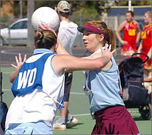 Emily Cooper under pressure from Rous 2's Melissa Kennedy. Emily Cooper under pressure from Rous 2's Melissa Kennedy.