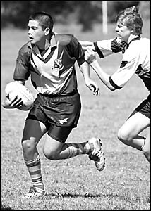 WOODLAWN centre Chris Binge evades a Campbelltown opponent yesterday on the way to a victory in the Cochrane Cup Statewide semi WOODLAWN centre Chris Binge evades a Campbelltown opponent yesterday on the way to a victory in the Cochrane Cup Statewide semi