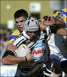 Seagulls Jeremy Walters grimaces collared by Mat Harley Seagulls Jeremy Walters grimaces collared by Mat Harley