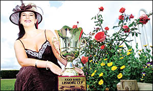 WINNING WAYS: Kylie Scofield, Face of the Lismore Cup, sponsored by Bondfields Shoes, with the winning trophy for today?s main WINNING WAYS: Kylie Scofield, Face of the Lismore Cup, sponsored by Bondfields Shoes, with the winning trophy for today?s main