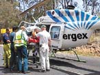 The injured son is carried to the Energex helicopter. The injured son is carried to the Energex helicopter.