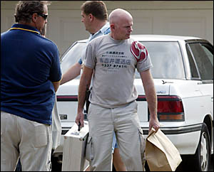 TWEED detectives carry away goods as evidence from a drug bust carried out at West Tweed Heads yesterday afternoon. TWEED detectives carry away goods as evidence from a drug bust carried out at West Tweed Heads yesterday afternoon.