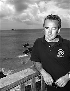 Rob Dalton, of the Byron Bay Dive Centre, surveys Julian Rocks off Byron Bay, a breeding habitat of the endangered grey nurse s Rob Dalton, of the Byron Bay Dive Centre, surveys Julian Rocks off Byron Bay, a breeding habitat of the endangered grey nurse s