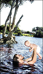 LAKE FANS: Matthew Lane, from Palmwoods, with his five-month-old daughter, Ayla Willow Eden, at Lake Ainsworth. Picture: CATHY LAKE FANS: Matthew Lane, from Palmwoods, with his five-month-old daughter, Ayla Willow Eden, at Lake Ainsworth. Picture: CATHY