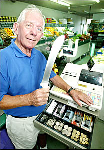 TUGUN fruit shop owner James O?Reilly defended his takings with his own knife after a knife-wielding bandit attempted to steal TUGUN fruit shop owner James O?Reilly defended his takings with his own knife after a knife-wielding bandit attempted to steal