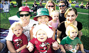 Waiting in anticipation for the carols to begin are, from left, Lucas, 2, Tony, Zachary,5 months, and Kim Flood from Lismore He Waiting in anticipation for the carols to begin are, from left, Lucas, 2, Tony, Zachary,5 months, and Kim Flood from Lismore He