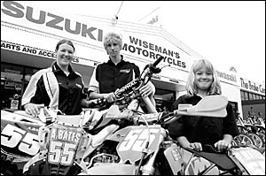 Ashlea Bates, left, Chris Middlemiss and Elisha Bates check bike 55 for battle scars after its first outing in Toowoomba. Ashlea Bates, left, Chris Middlemiss and Elisha Bates check bike 55 for battle scars after its first outing in Toowoomba.