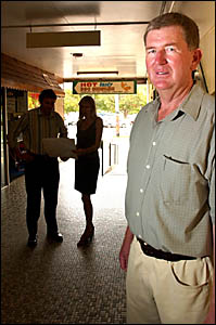 Holder Baker Enterprises director Andrew Baker, front, stands in the Palace Arcade while architect Paul Sheppard, back left, of Holder Baker Enterprises director Andrew Baker, front, stands in the Palace Arcade while architect Paul Sheppard, back left, of