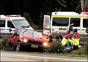 Highway havoc . . . a pregnant woman in this car was taken to hospital following a smash at Boambee yesterday. Highway havoc . . . a pregnant woman in this car was taken to hospital following a smash at Boambee yesterday.