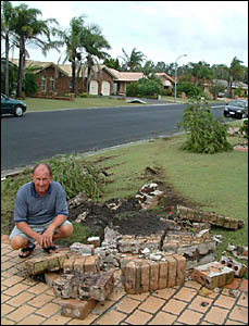 Halyard resident, Laurie Thompson surveys the mess in his front lawn after a car took out his letterbox. Halyard resident, Laurie Thompson surveys the mess in his front lawn after a car took out his letterbox.