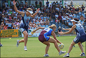 South Queensland Sharks player Emma Giarola is surrounded by South Queensland Sharks players Amanda Judd, left and Maribel Ziab South Queensland Sharks player Emma Giarola is surrounded by South Queensland Sharks players Amanda Judd, left and Maribel Ziab