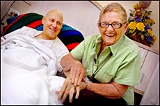 Merv Castledine is a happy recipient of a hand massage from oncology volunteer Fay Owens Merv Castledine is a happy recipient of a hand massage from oncology volunteer Fay Owens