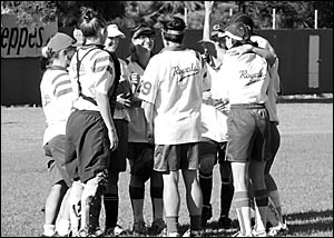Members of the Royals Softball Club A reserve team gather in a huddle to celebrate their grand final win over Woolgoolga where Members of the Royals Softball Club A reserve team gather in a huddle to celebrate their grand final win over Woolgoolga where