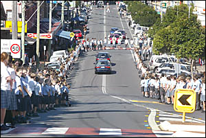 STUDENTS from Mt St Patrick College form a guard of honour as hearses containing Kieran and Jordan Thomas move away from the Ca STUDENTS from Mt St Patrick College form a guard of honour as hearses containing Kieran and Jordan Thomas move away from the Ca