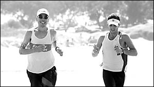 Ray Wareham, left, from Sydney and Port Macquarie?s Andrew Thompson cross the line tied for second in the Great Ocean Run. Ray Wareham, left, from Sydney and Port Macquarie?s Andrew Thompson cross the line tied for second in the Great Ocean Run.