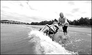 Ed Atkinson and his brother, Jeremy enjoy a trip to the beach Ed Atkinson and his brother, Jeremy enjoy a trip to the beach