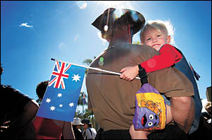 Troy Henderson-Smith and his daughter, Kirra, at the Woolgoolga march yesterday. Troy Henderson-Smith and his daughter, Kirra, at the Woolgoolga march yesterday.
