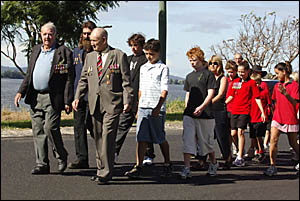 A small band of returned servicemen lead the school children in the march at Lawrence. A small band of returned servicemen lead the school children in the march at Lawrence.