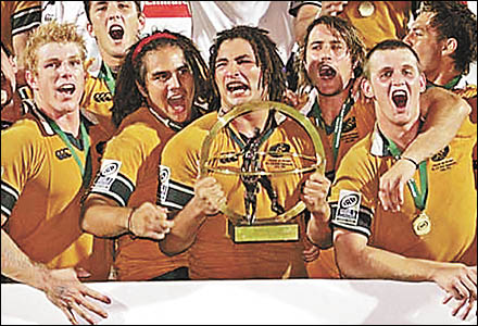 Dorrigo?s AJ Gilbert, second from left, celebrates with teammates after Australia?s victory in the Under-19 Rugby World Cup. Ph Dorrigo?s AJ Gilbert, second from left, celebrates with teammates after Australia?s victory in the Under-19 Rugby World Cup. Ph