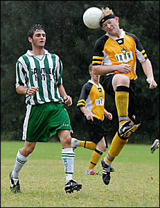 Matthew Cheeney leaps high above Sawtell?s Rory Goddard Matthew Cheeney leaps high above Sawtell?s Rory Goddard