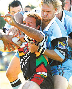 Sawtell fullback, Steve Sansom is mobbed by the Woolgoolga Seahorses defence including centre Drew Vines during the Group 2 Rug Sawtell fullback, Steve Sansom is mobbed by the Woolgoolga Seahorses defence including centre Drew Vines during the Group 2 Rug