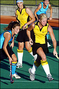 Casuarina?s Sharon Buchanan (left) closes in on Labrador rival Kylie McEniery during their JH Williams Hockey League encounter Casuarina?s Sharon Buchanan (left) closes in on Labrador rival Kylie McEniery during their JH Williams Hockey League encounter